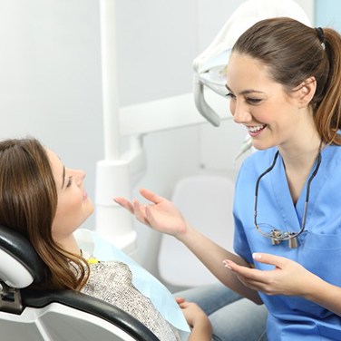 patient talking to their dental hygienist 