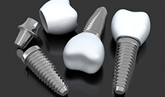 three dental implant posts with abutments and crowns 