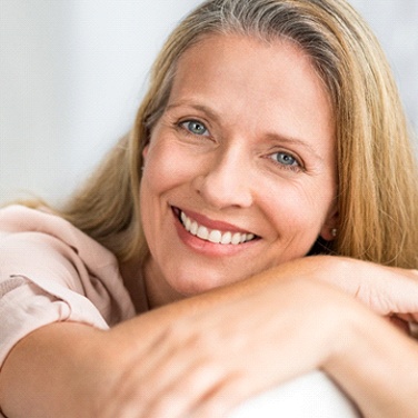 Woman smiling with her arms crossed