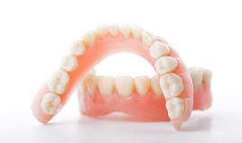 Close up of upper and lower denture with white background