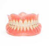 a pair of full dentures in Wilton Manors