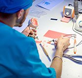 a dental technician working on creating dentures