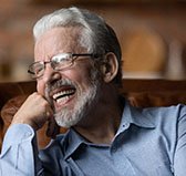 a man in Wilton Manors smiling with his dentures