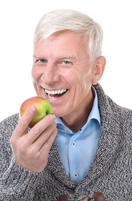 man in orange shirt smiling