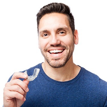 man holding invisalign