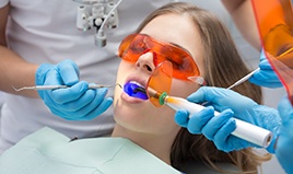 Female patient receiving a dental filling