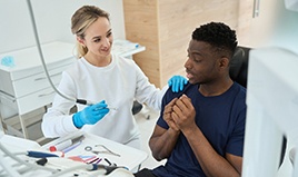 Male patient feeling nervous at dentist’s office