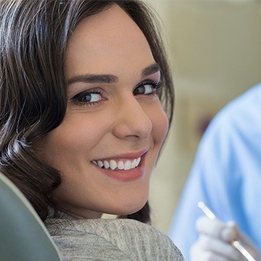 woman smiling over shoulder