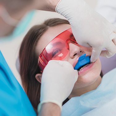 girl getting fluoride treatment