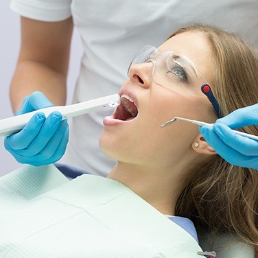 intraoral camera in woman's mouth