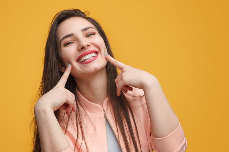 Woman shows pretty smile